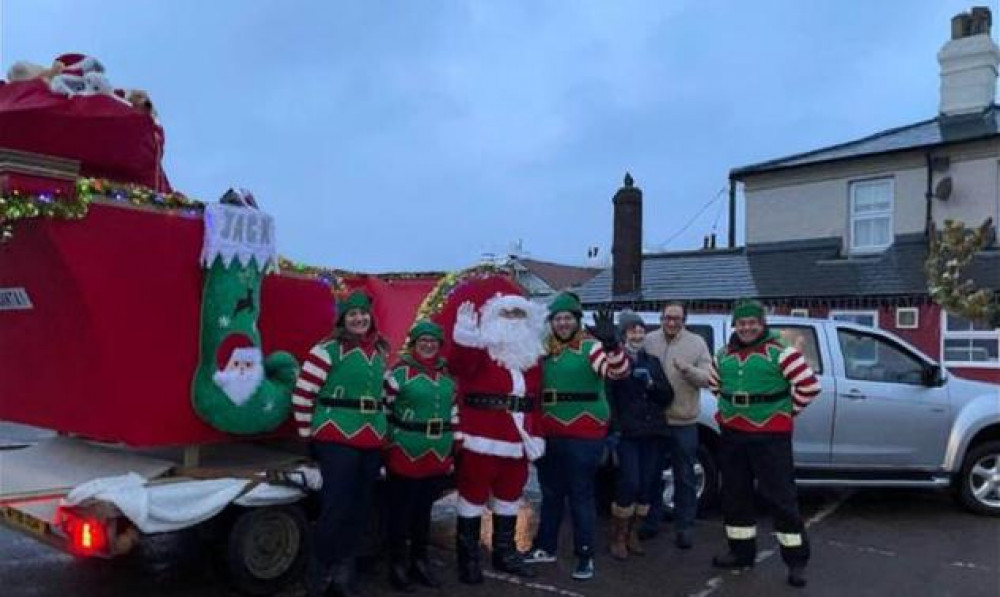 Santa and elves from Rose helped raise £750 (Picture: Rudolph) 