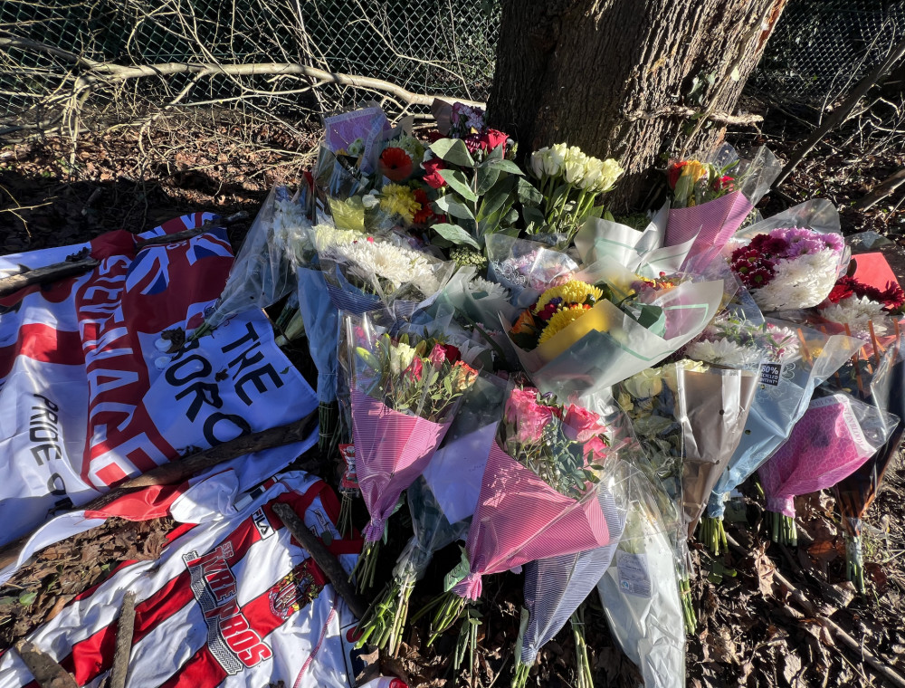 A shocked community comes together to pay tribute by leaving a large number of flowers and messages at the scene of the accident on the A602 in Hitchin. CREDIT: Hitchin Nub News 