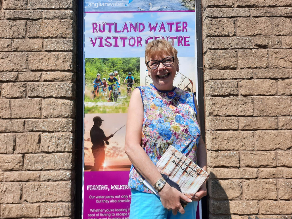 Tracey with a copy of Oncar's Adventure at Rutland Water at the launch event last year. Image credit: Nub News. 