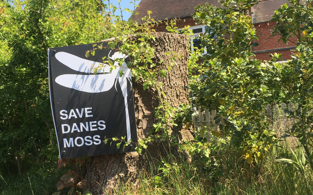 Macclesfield: A 'SAVE DANES MOSS' poster with a silhouette dragonfly. (Image - Macclesfield Nub News)