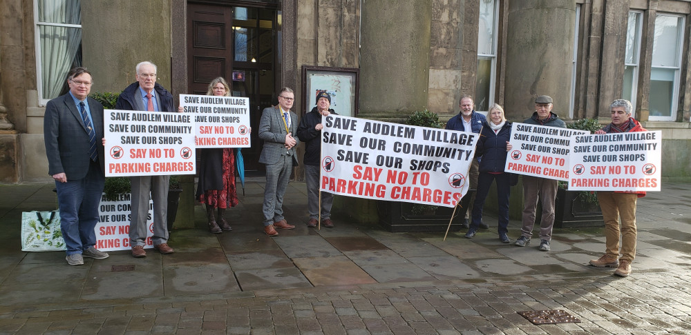 Protesters outside the meeting. (Photo: Belinda Ryan, LDRS)