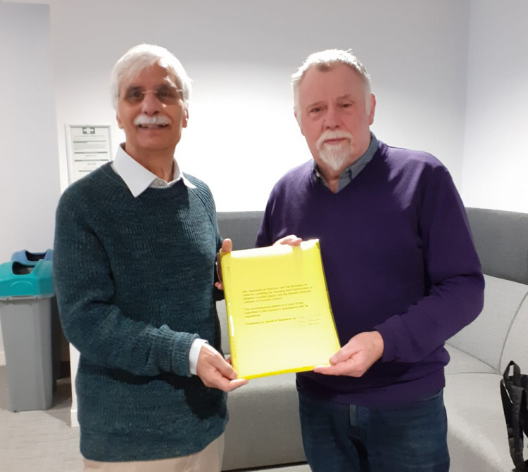 Kabul Sandu and Peter O'Rouke (right) took their petition to government.