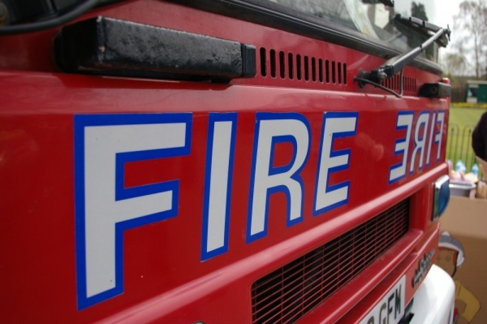 Firefighters rush to put out fire after black smoke floods the area ...