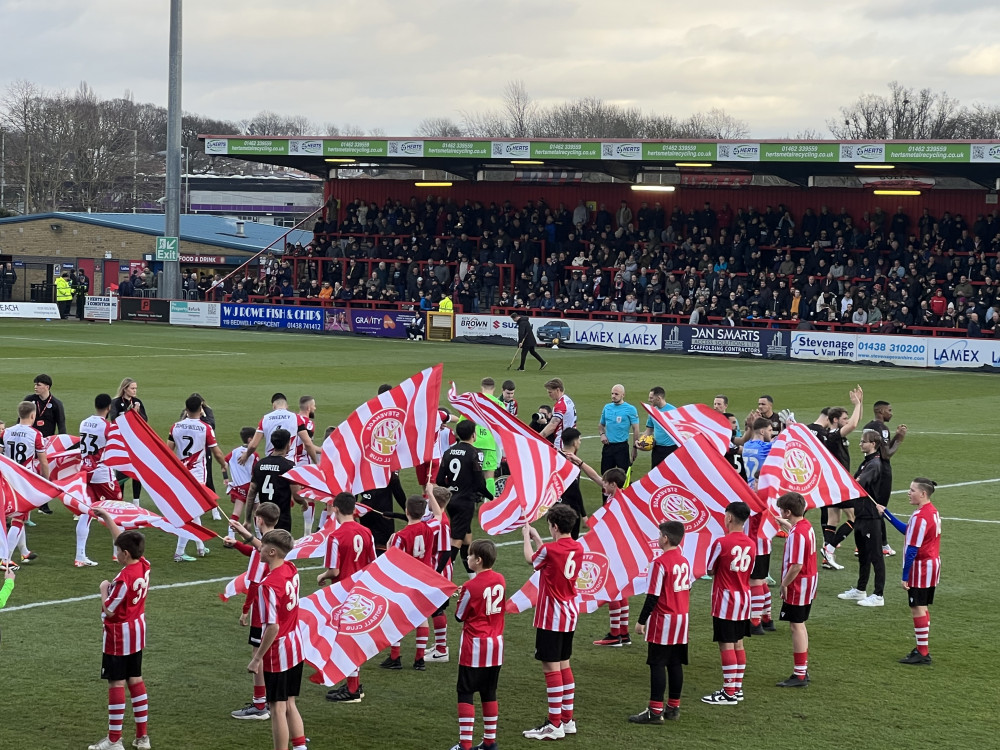 Stevenage hosted Blackpool at Broadhall Way on Saturday afternoon. PICTURE: The teams head out onto the Lamex pitch prior to kick-off in their League One clash. CREDIT: @laythy29 