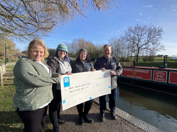 (L-R) Moira Furnace & Country Park's operations manager Katrina Pentelow, assistant site manager, Jess Cram, Ashby Co-op Member Pioneer Monica, and Moira Co-op store manager, Dave Canner, as the donation is presented