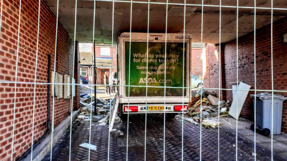 An Asda delivery van got stuck underneath the entrance of a block of flats in Middlewich. (Photo: Nub News)