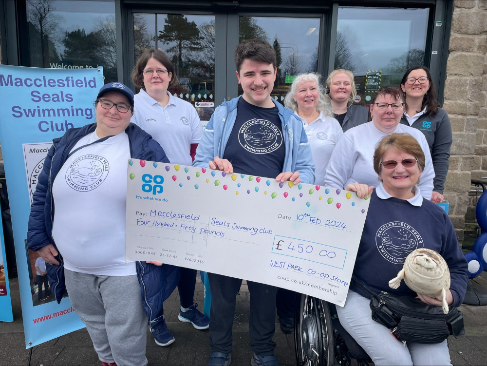 Representatives of the Co-op and Macclesfield Seals Swimming Club pose with the £450 donation. (Image - @LouiseMPCoop)