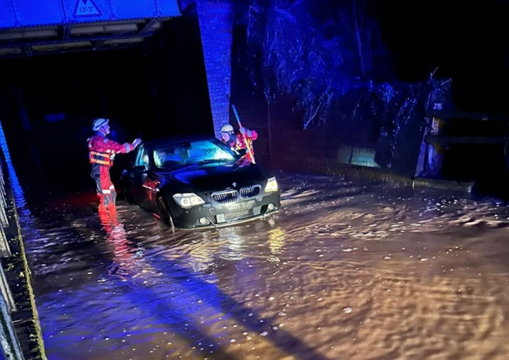 The BMW was stuck under the railway bridge on Salters Lane (image via Henley Fire Station)