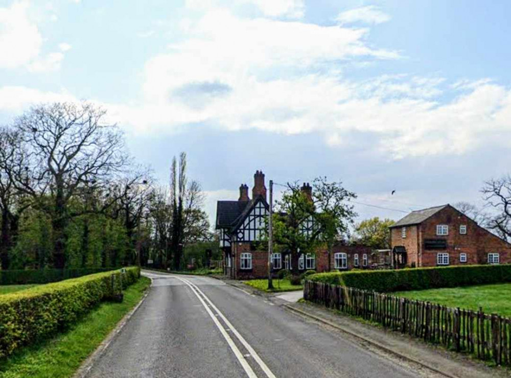 Road closed for hours after car crashes into telegraph pole near