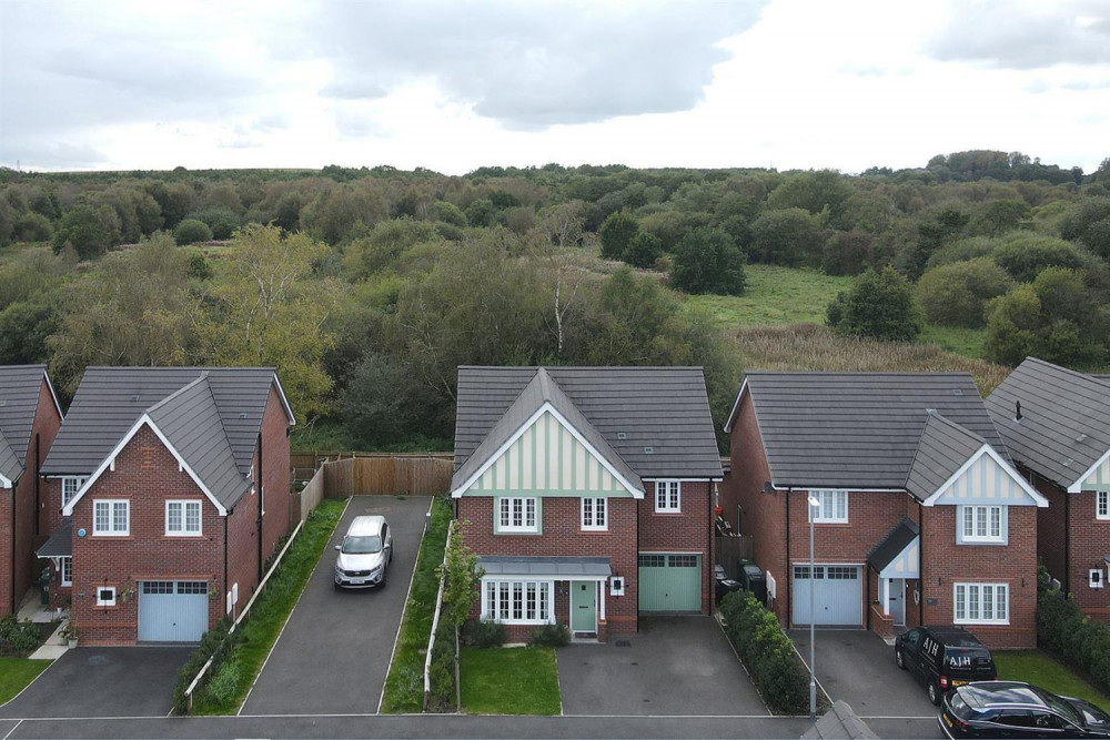 The Silk Rose Drive house (centre) is on the market for £449,950. (Image - Holden and Prescott) 