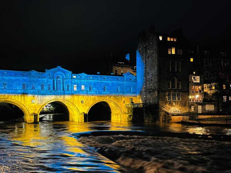 Pulteney Bridge in Bath as part of a national campaign to raise awareness of the 24 months of war since the Russian invasion, image B&NES