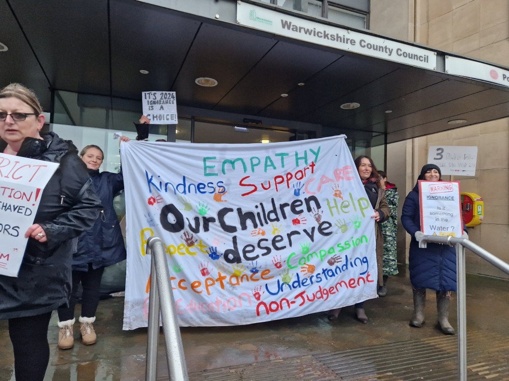 Protesters braved the rain to make their feelings known outside Shire Hall earlier this month (image via Elissa Novak)