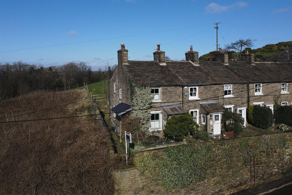 This quintessential English cottage in the pretty village of Kerridge, boasts lovely views over open countryside. 