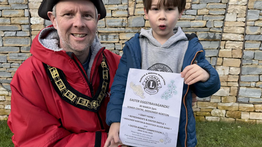 Cllr Gordon Mackay and son with Easter poster