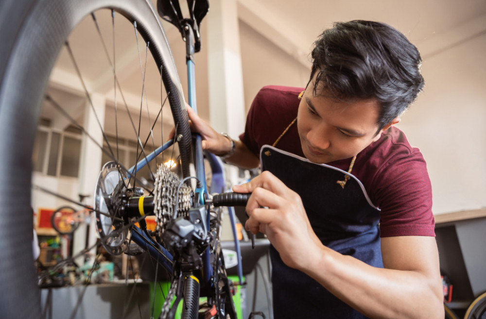 Repairing a bicycle, image CAG Somerset network