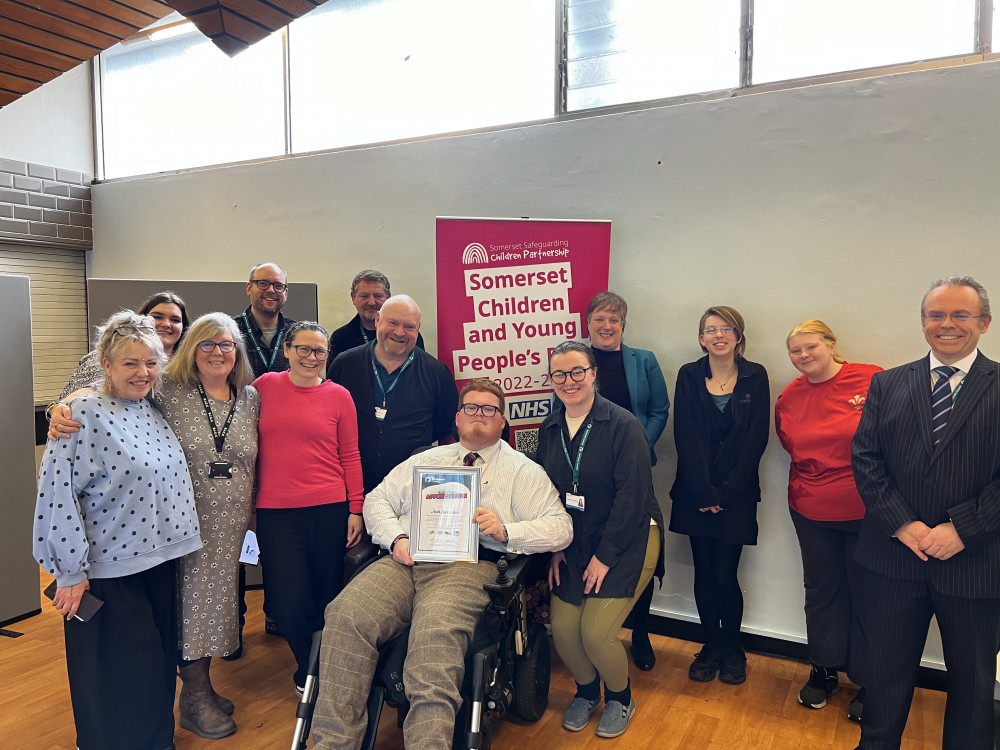 Josh Lancaster with Somerset Council Leader Bill Revans, Chief Executive Duncan Sharkey, Executive Director for Children, Families and Education Claire Winter, members of the Somerset Council Engagement and Participation team and members of youth voice groups