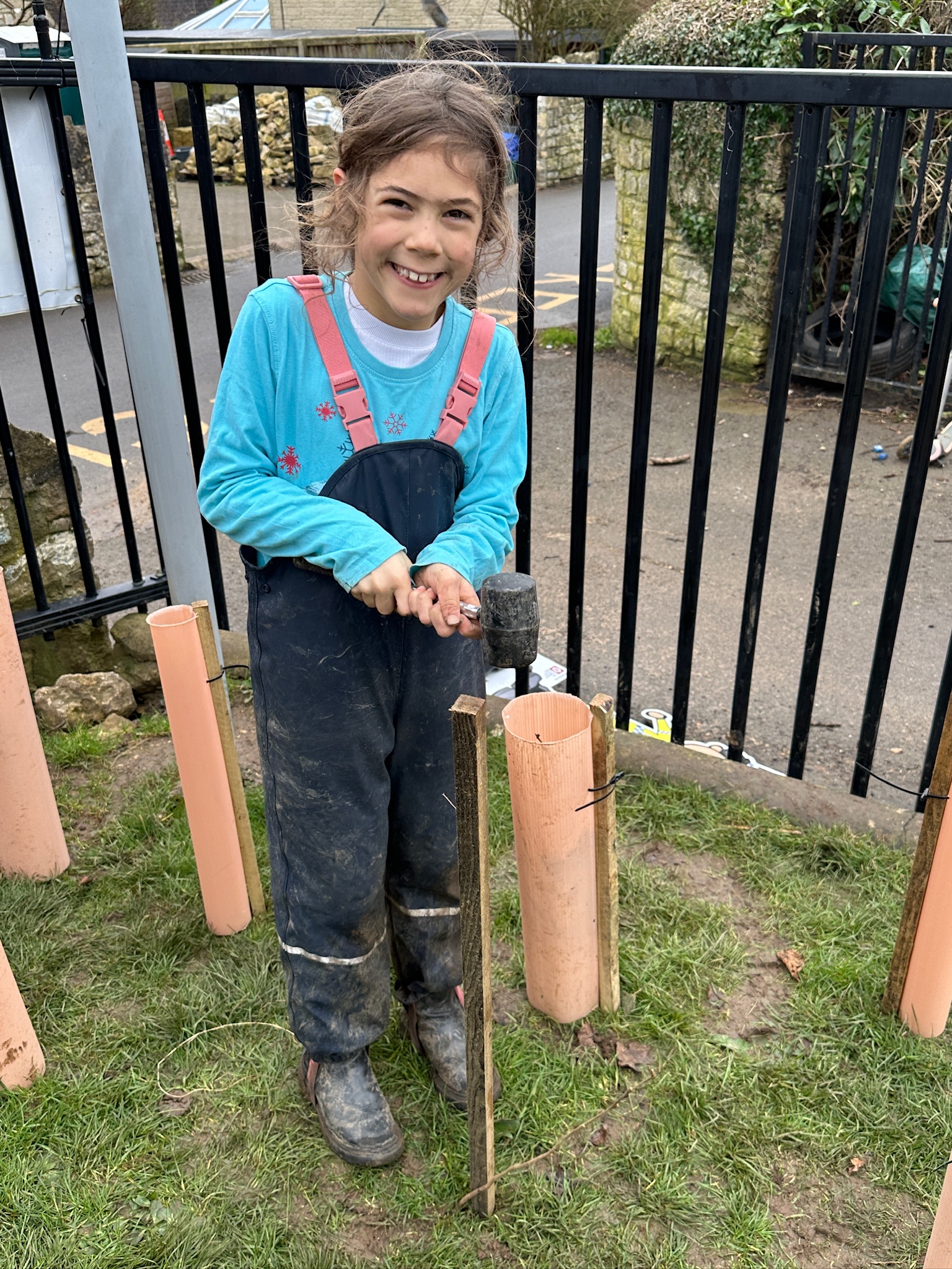 Shoscombe Primary School student and Eco Team member Rosemary Kelly (8) helps to plant a new wildlife hedge at the school. Image Shoscombe School