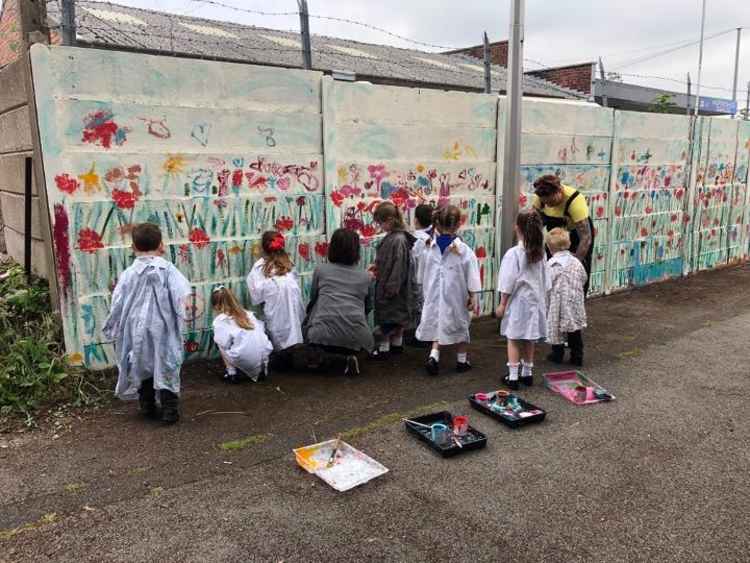 Kingsley St John's pupils work on their wildflower mural. Image courtesy of Kingsley St John's Primary School