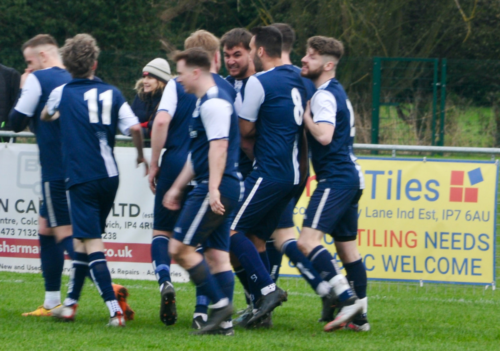 Alex Gibson congratulated after Woolverstone United's fourth goal (Picture: Nub News)