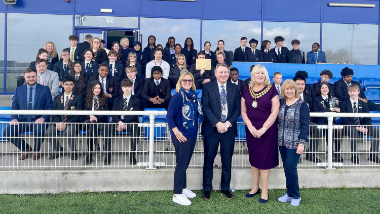 Thurock Mayor Cllr Sue Little and consort Brian Little welcomed competing students to Aveley FC.  Also pictured are Yvonne Evans (right), Enterprise Coordinator for the Greater Essex Careers Hub, and Jo Sedley-Burke, Managing Director of Trunk Logistics, together with teachers and students from the competing schools.