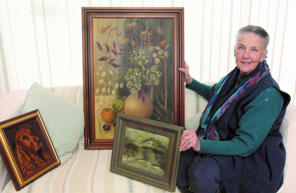 Gail at home with some of her late mother's works, to be auctioned on 11 May