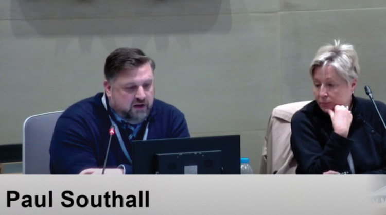 Paul Southall delivers his report - prompting a response from chair Cllr Val Morris-Cook, right. 