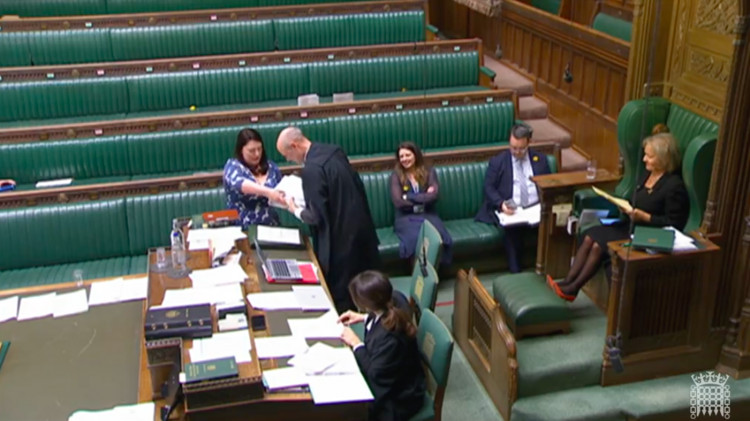 Alicia Kearns presenting the signatures. Image credit: Parliament TV / screenshot. 