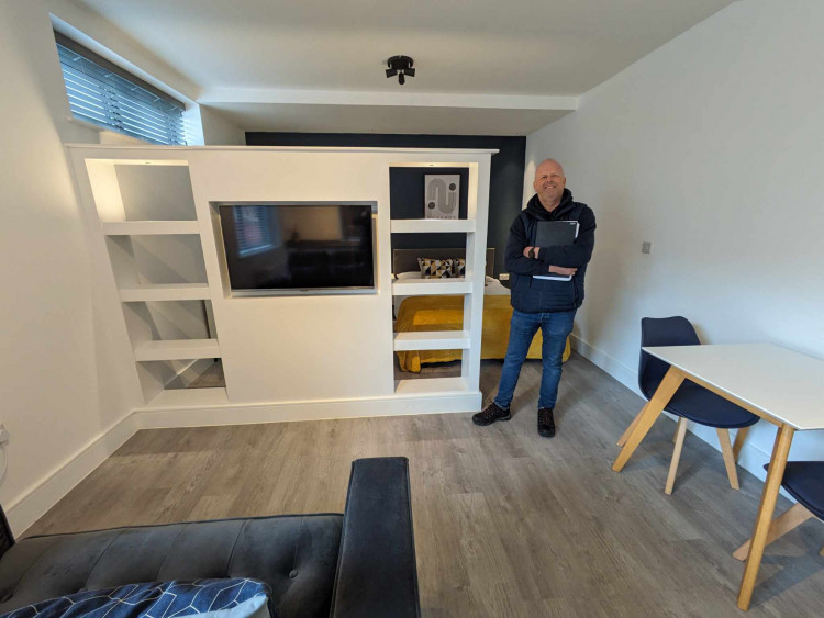 Sam Brown, Premier Living Group co-owner, inside one of the stylish apartments at Lea House. (Photo: Nub News)