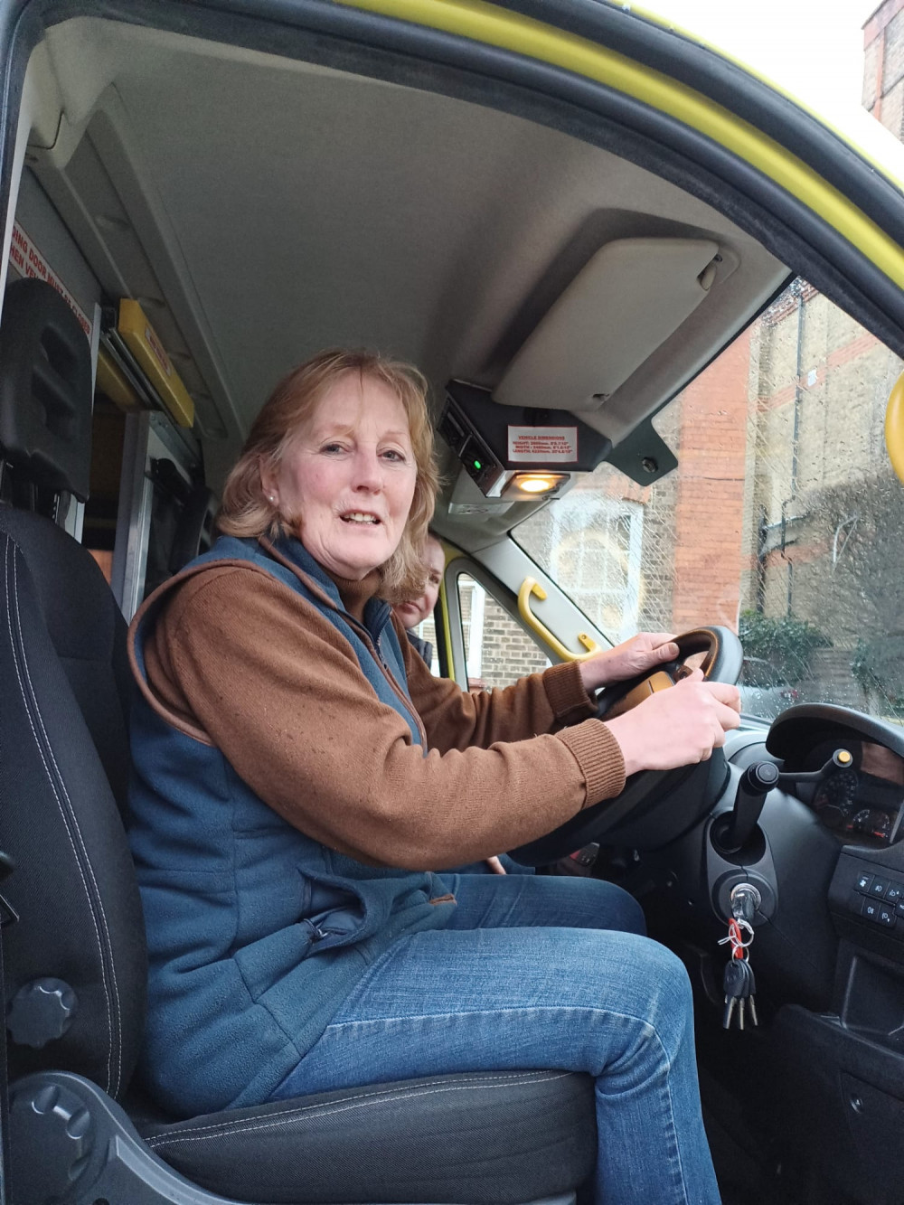 Harriet Sandys at the wheel of an ambulance