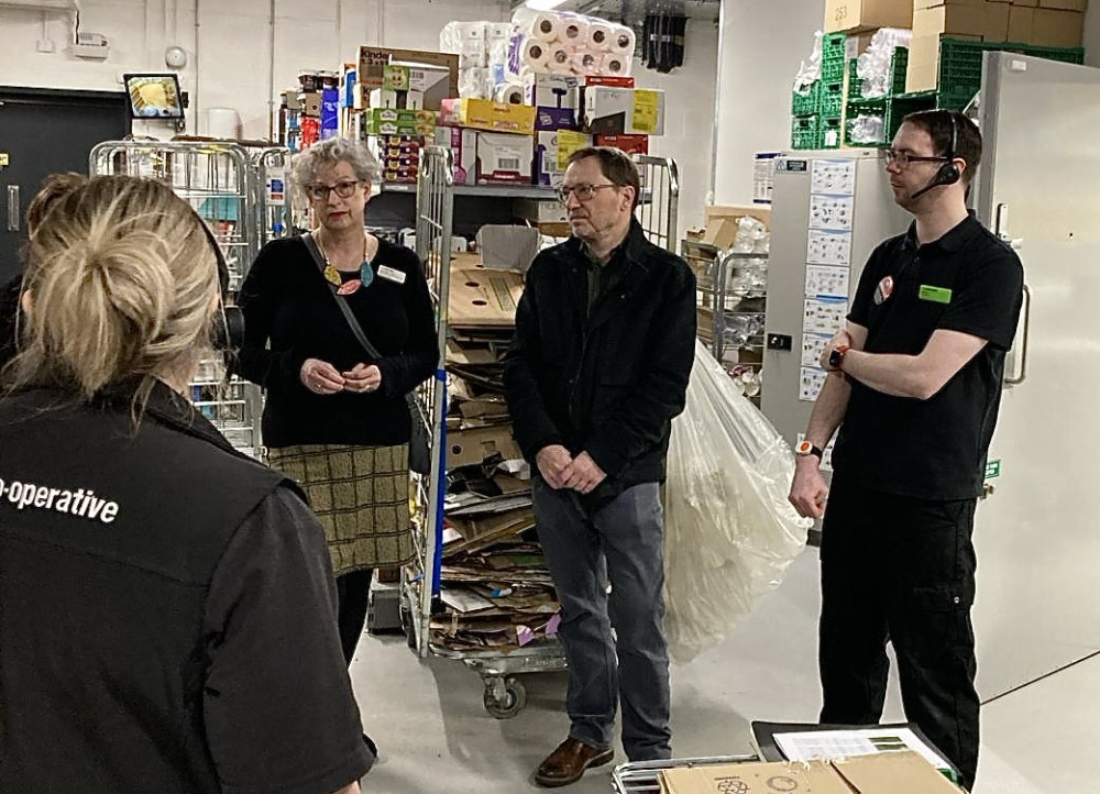 Cllr Chris Smith discusses retail crime with shop workers in Ashby. Photo: Supplied