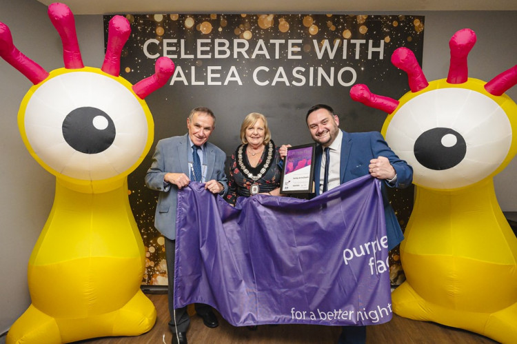 Ashby Mayor, Cllr Avril Wilson, and Town Centre Manager, Stuart Benson, celebrate the Purple Flag award at a ceremony in Nottingham last month. Photo: Ashby de la Zouch Town Council