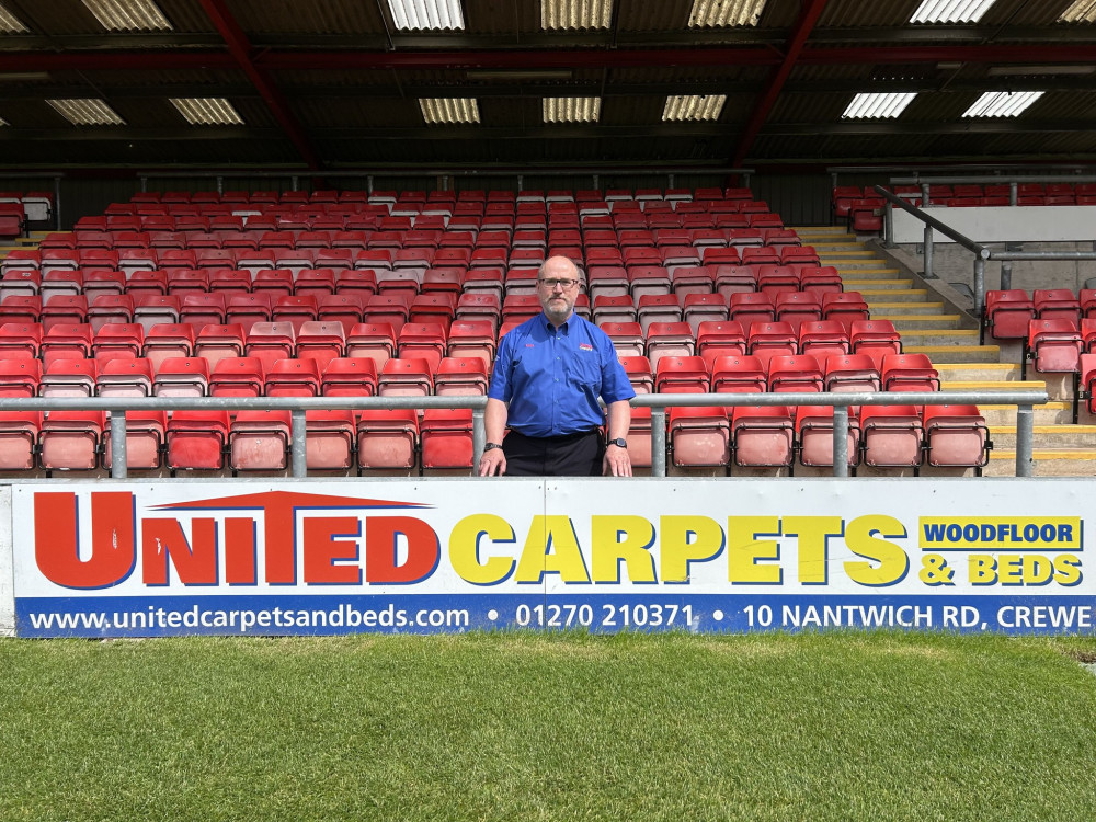 Eddie Davies, owner and manager of United Carpets, has had a sponsorship board at Crewe Alex for several years (Nub News).