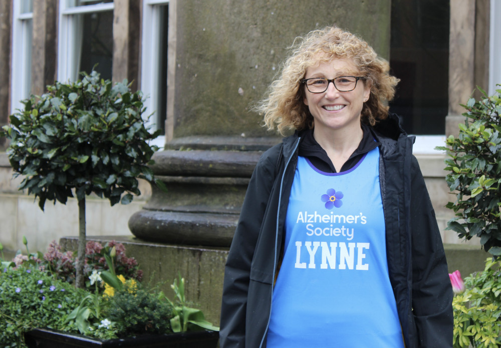 Lynne Graves, outside Macclesfield Town Hall, clad in her running gear. (Image - Macclesfield Nub News)