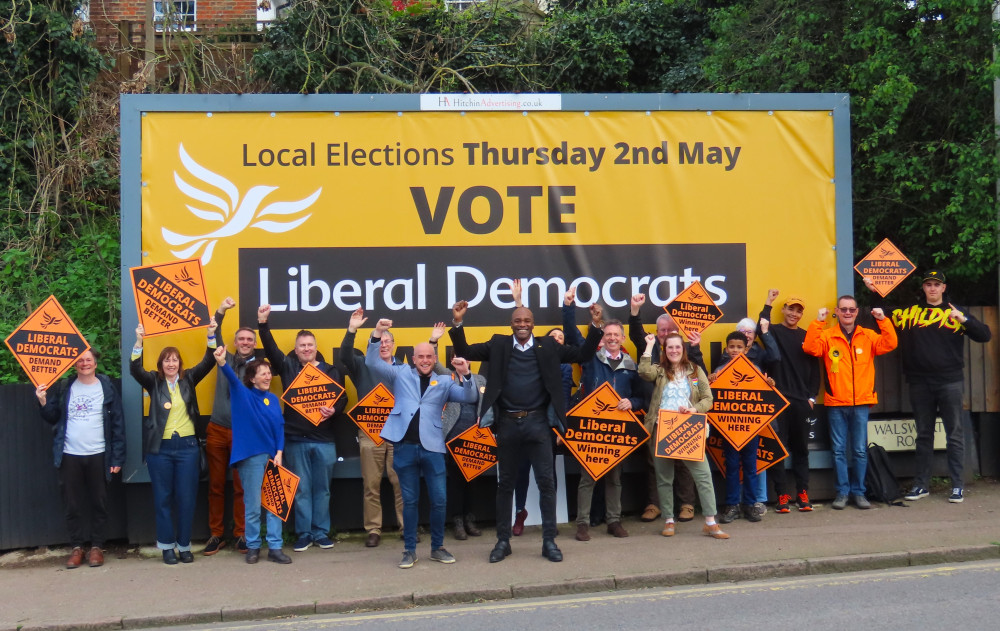 The Liberal Democrats have launched their local elections campaign for Hitchin and North Herts. PICTURE: Chris Lucas and the Lib Dems in front of their billboard at Hitchin railway station. CREDIT: Lib Dems 