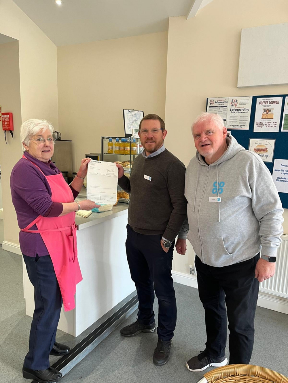 Jean Ellershaw with Co-op manager, Colin Mason and Co-op Member Pioneer, Arnie Laing. (Photo: Arnie Laing) 