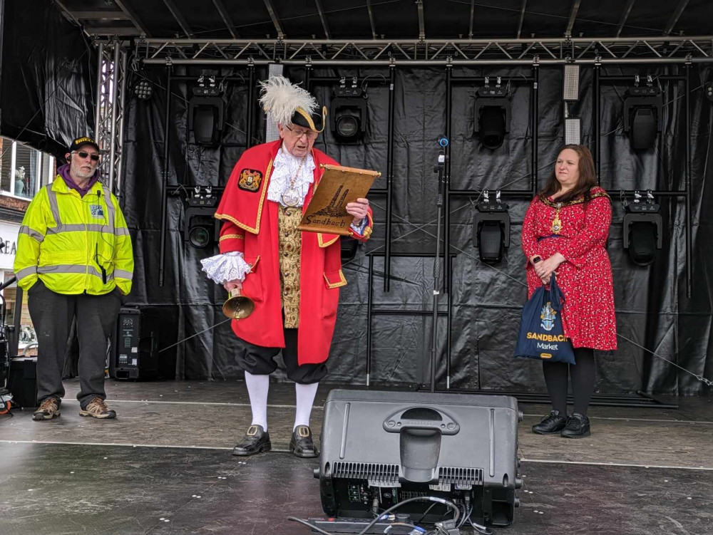 Town Crier, Dennis Robinson, range his bell at the opening of Sandbach Transport Festival.  (Photo: Nub News)   