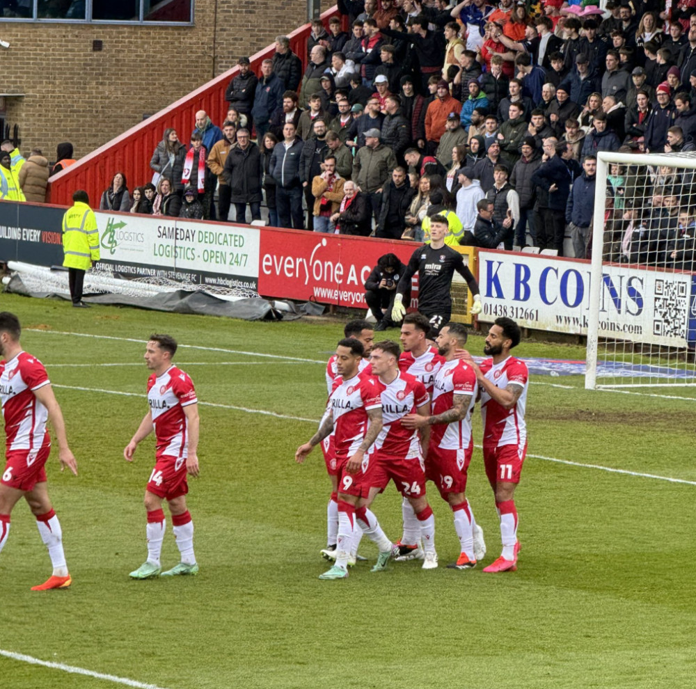 The Stevenage side celebrate Kane Hemmings penalty moments before half time. CREDIT: @laythy29