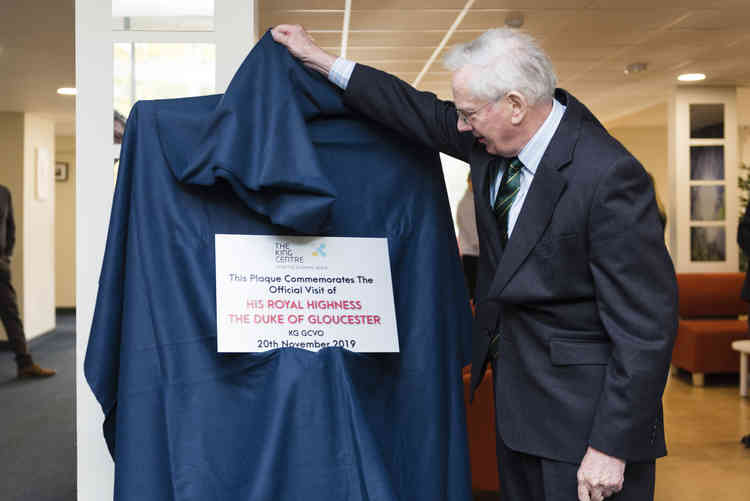 His Royal Highness unveiling a commemorative plaque marking his visit with assembled guests