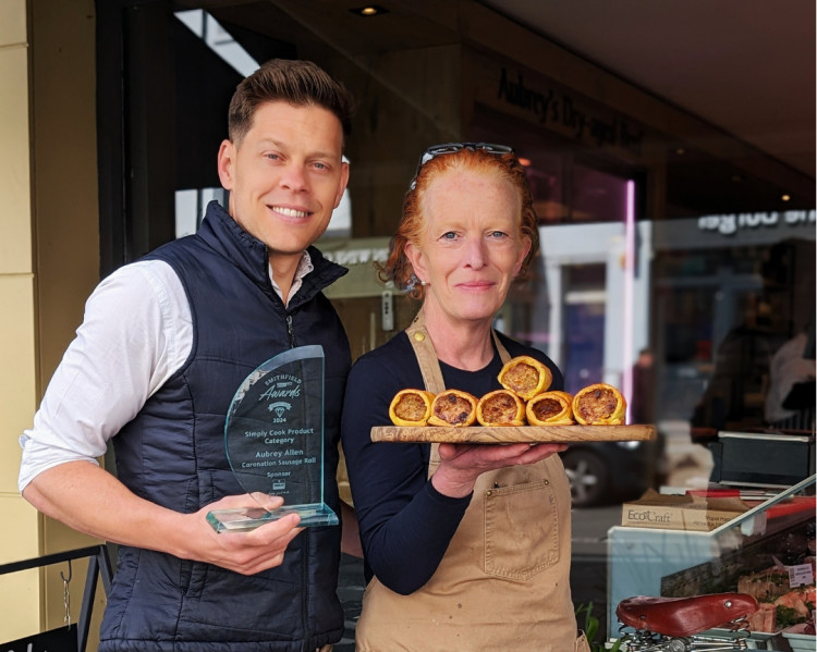 Dillyn Saunders, Shop Manager and Grainne Hayden, Deli Manager with Aubrey Allen’s award winning Coronation Sausage Roll (image supplied)