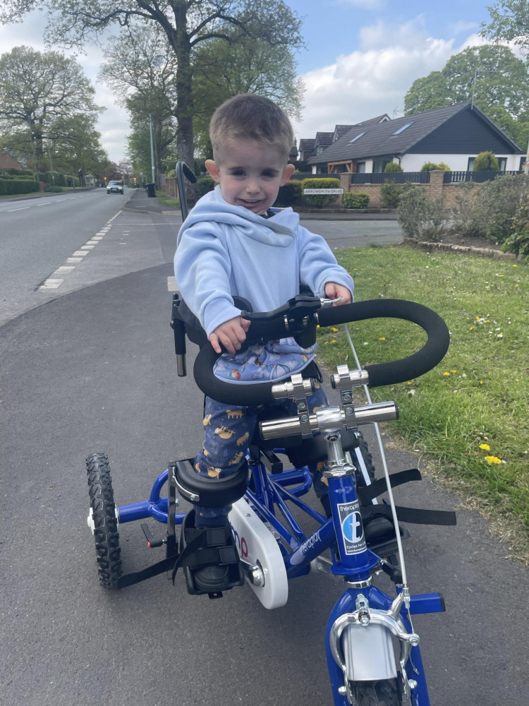 Little Fin Richards with his new trike allowing him to get out and about. (Photo: Leann Thackwell)