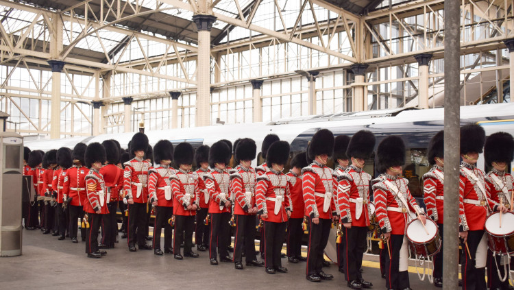 Armed Forces band prepares for the King and Queen's first year anniversary of the coronation in London Waterloo Station (credit: South Western Railway).