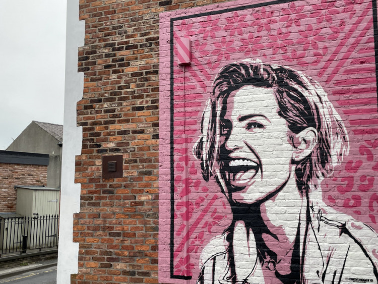 A breast cancer research project was launched last year upon the wish of Sarah Harding, the Girls Aloud singer from Stockport - its success coincides with the unveiling of a new town centre mural (Image - Alasdair Perry / artist: Deggy)