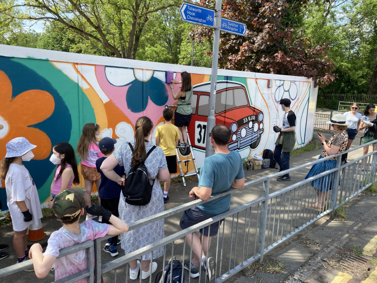 Roo Art and Surbiton locals working on the mural on Sunday, 12 May. (Photo: The Community Brain)