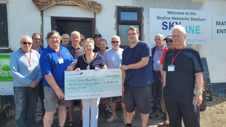 Babergh District Council Chair, Cllr Elisabeth Malvisi, presents the cheque to the Stour Valley Men’s Shed Chairman Adrian Beckham