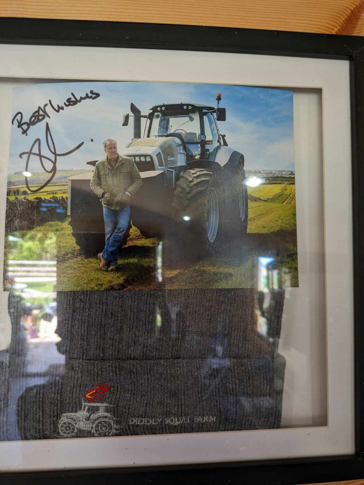 The photo and hat from Jeremy Clarkson stand proudly inside Alec's Farm Shop.  (Photo: Nub News)