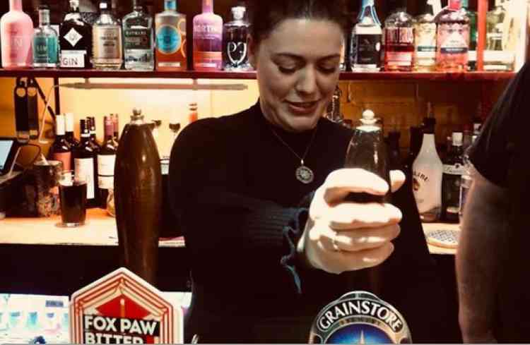 Alicia Kearns MP behind the bar