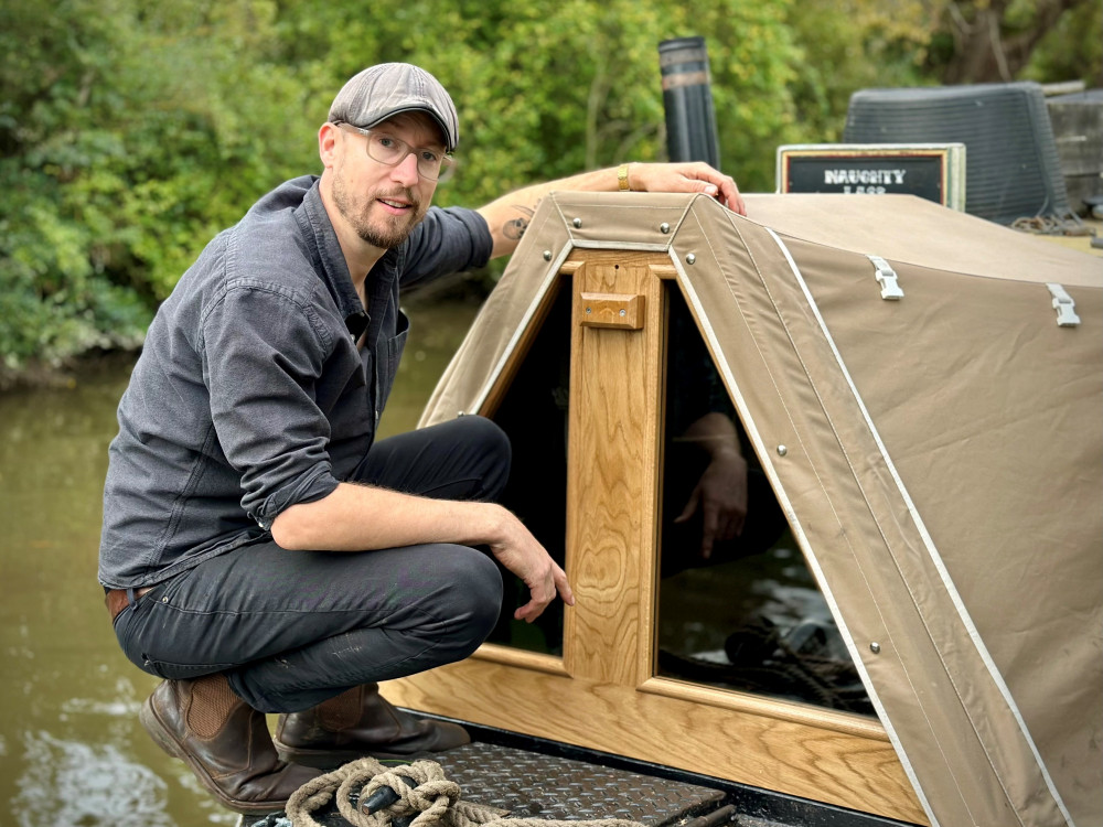 Robbie Cumming onboard in narrowboat 'Naughty Lass' (image by Stuart Woodman)