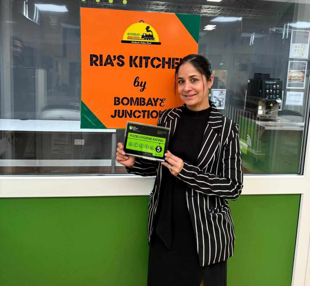 Joint owner of Bombaye Junction, Robby, holding the new FSA five-star food hygiene rating (Nub News).