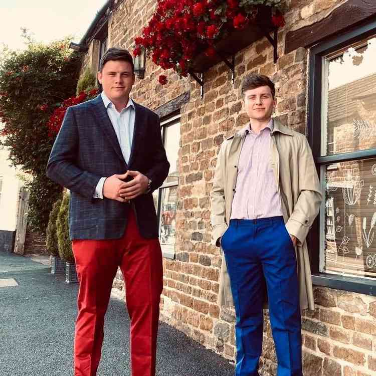 Tim in red trousers, Tom in blue