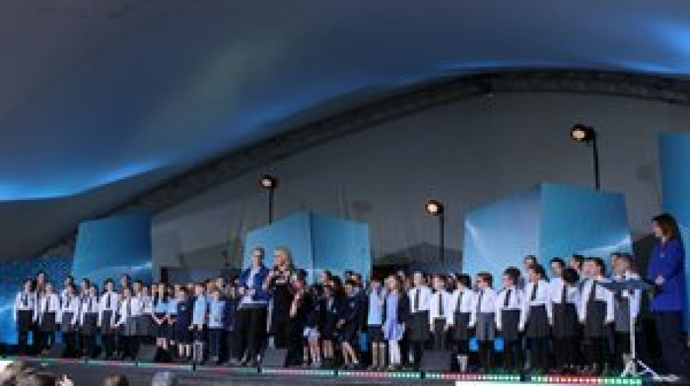 Iolo Morganwg pupils performing at Eisteddfod with H and Carryl Parry-Jones.